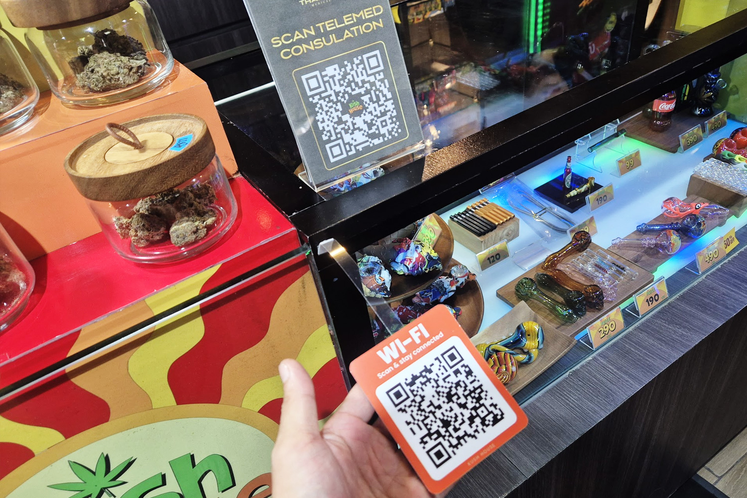 ThaiCannaMed QR code display at Kush House counter in Bangkok