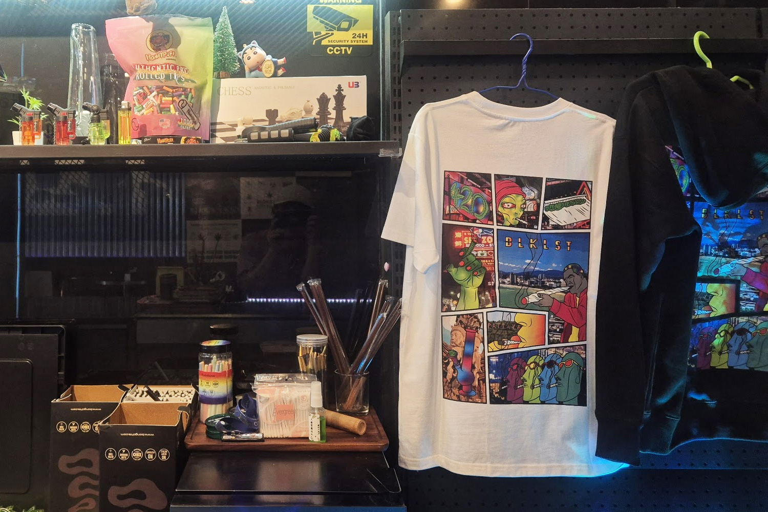 Pattaya-themed apparel at TAIMATON cannabis dispensary — original T-shirt designs popular as souvenirs among visitors