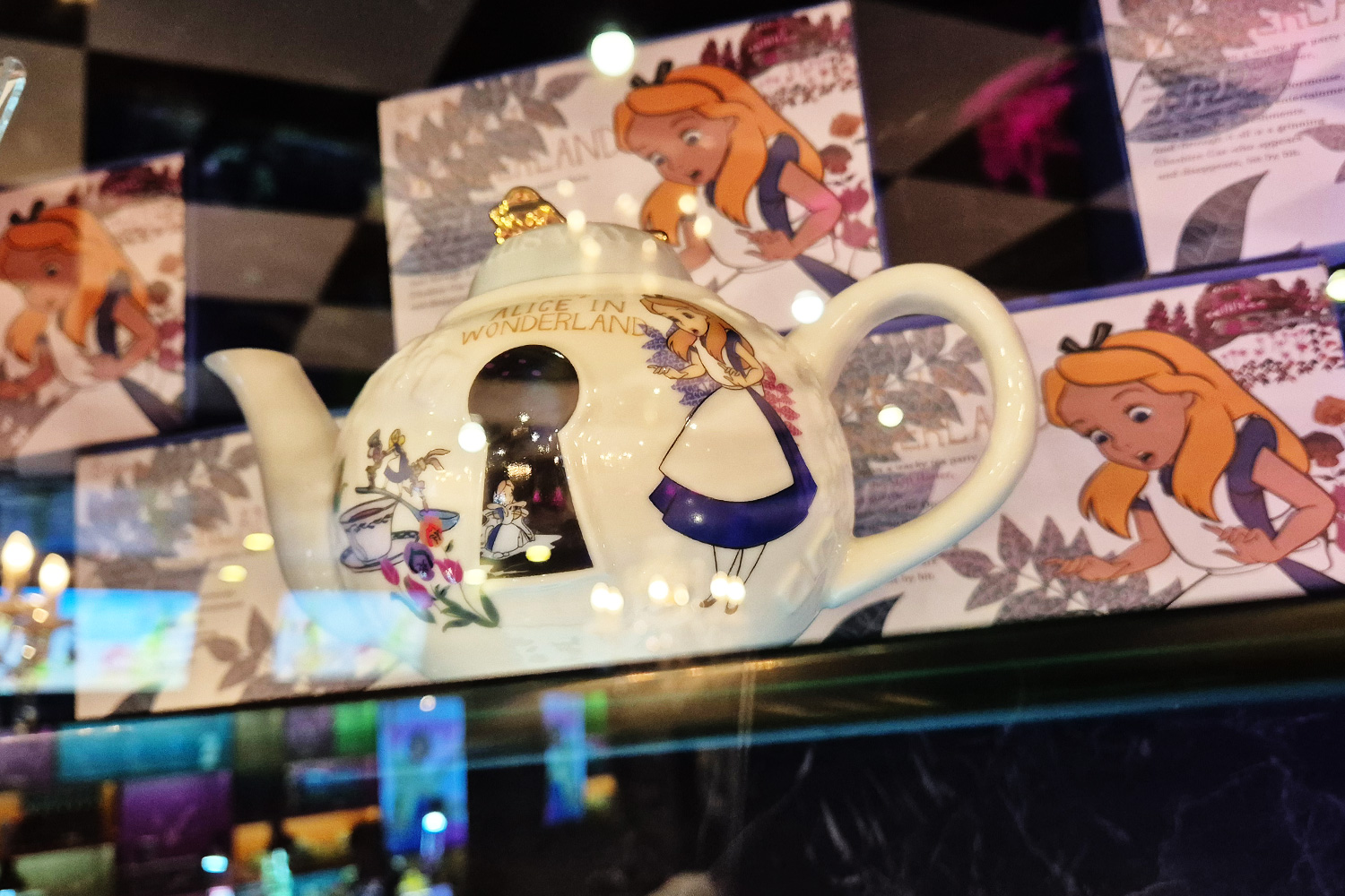 Alice in Wonderland original teapot — keyhole opening and gold lid knob detail