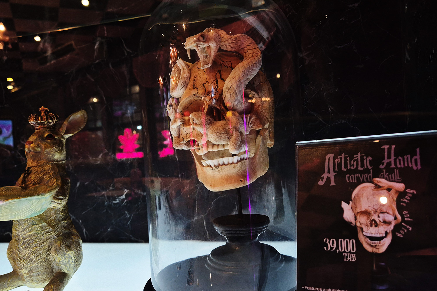 Artistic Hand Carved Skull — 39,000 THB one-of-a-kind art piece in glass dome at Wonderland Bangkok