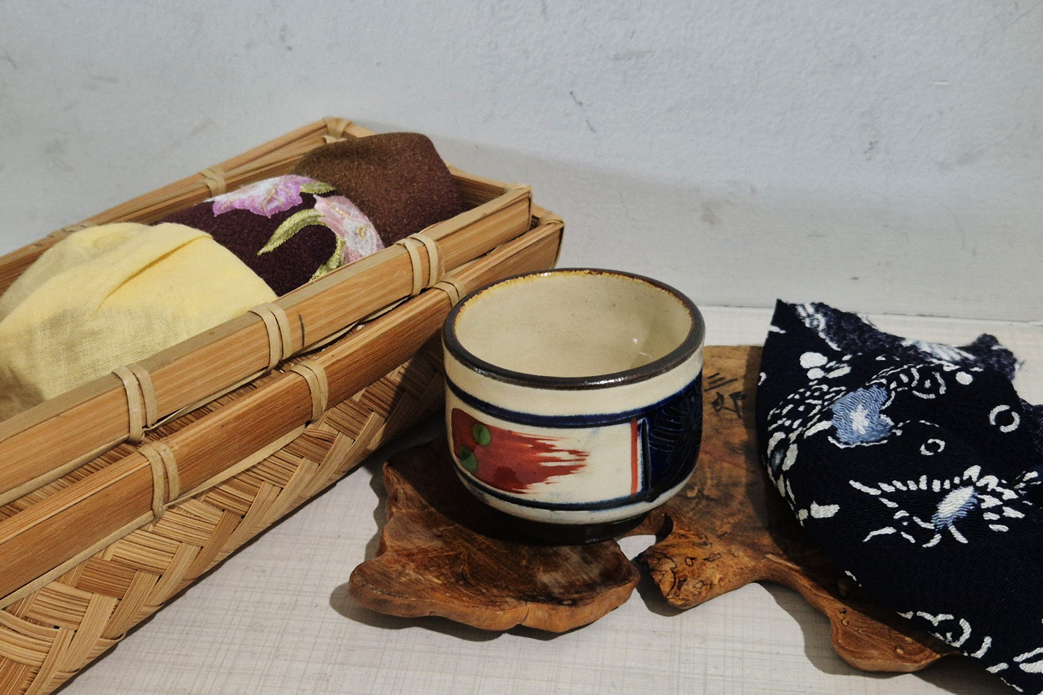 Tsuboya yachimun line-carved sake cup with blue color inlay
