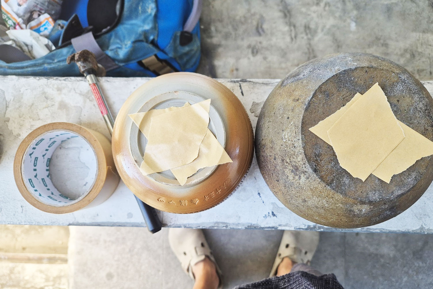 Drilling a drainage hole into a ceramic pot for cannabis bonsai at Green House, Nuanchan, Bangkok