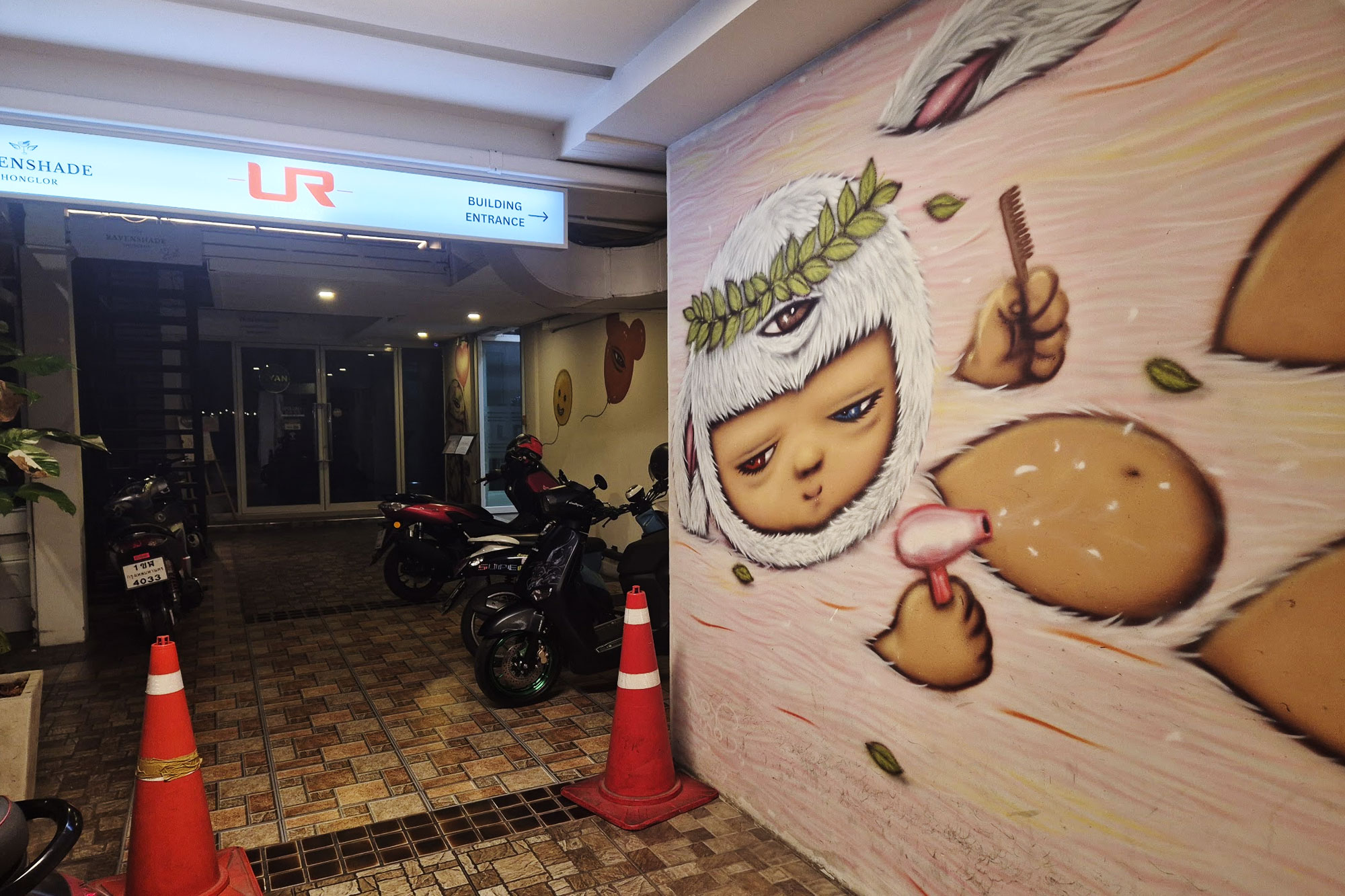 Distinctive wall art painted along the passage leading to Casa Verde BKK